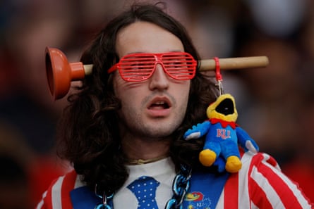 A Kansas fan in the stands with a fake plunger through his head.