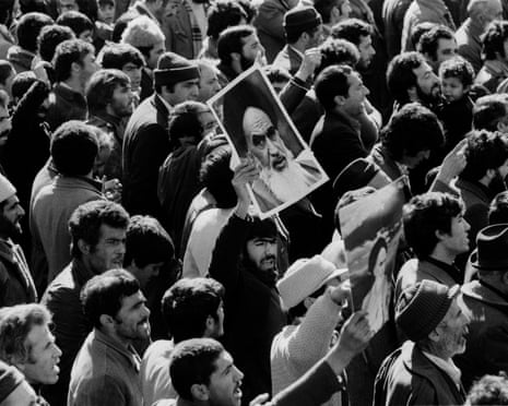 Posters of Ayatollah Khomeini during the 1979 Iranian revolution .