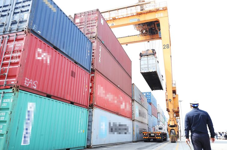 Containers are stacked at a port in Pyeongtaek, south of Seoul, in this file photo from April 24. Yonhap